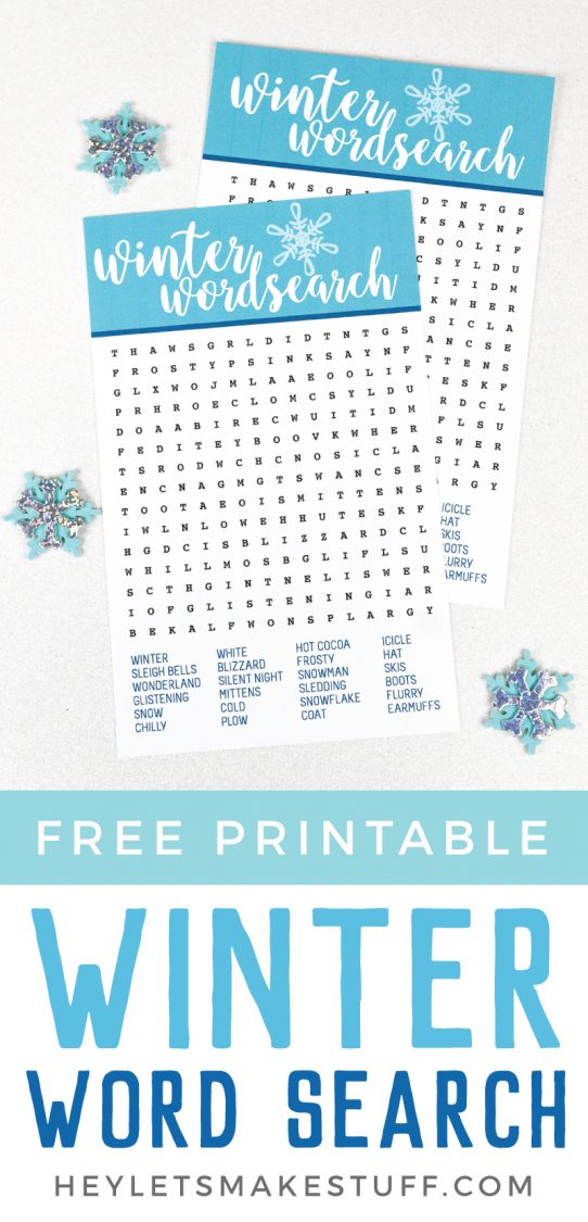 Decorative snowflakes lying next to two Winter Wordsearch papers with advertising for free printable Winter Wordsearch from HEYLETSMAKESTUFF.COM