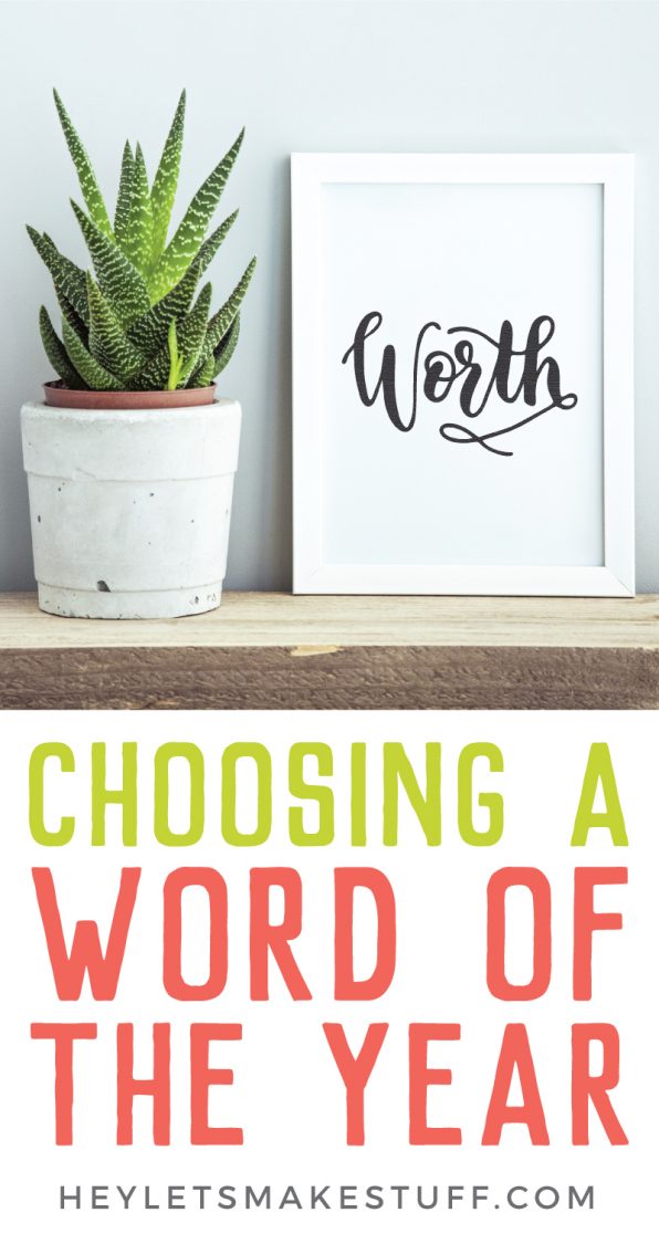 A plant sitting on a table next to a sign with a white frame and the sign says, \"Worth\" with advertising for Choosing a Word of the Year from HEYLETSMAKESTUFF.COM