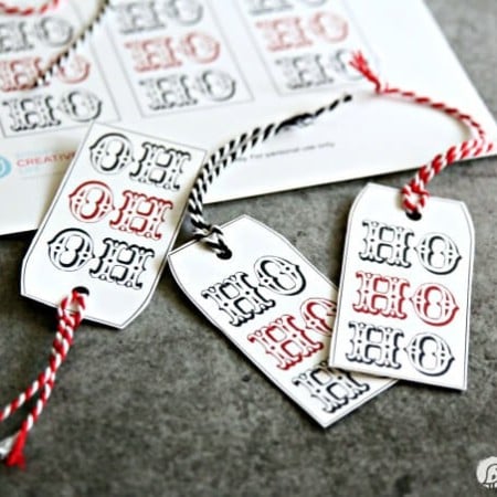 Close up of images of Christmas gift tags that say, HO HO HO"