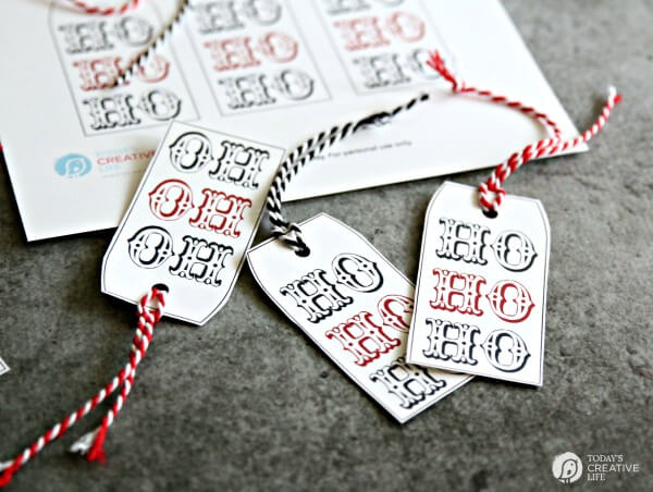 Close up of images of Christmas gift tags that say, HO HO HO\"