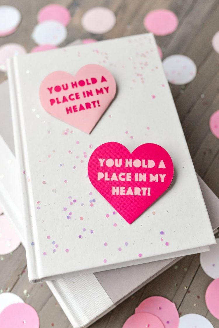 Two Valentine hearts designed with a saying that says, \"You Hold a Place in My Heart\"