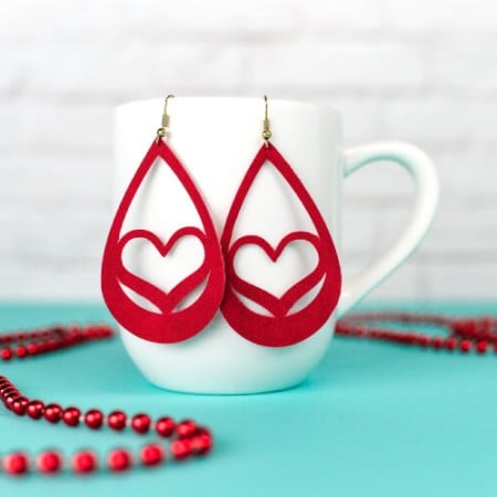 Use your Cricut to make these trendy these faux suede earrings—sweet hearts that are perfect for Valentine's Day. An easy Valentine's Day jewelry project.