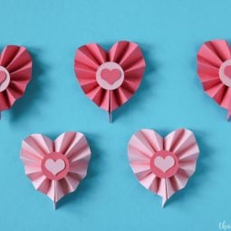 Several paper cut hearts against a blue background