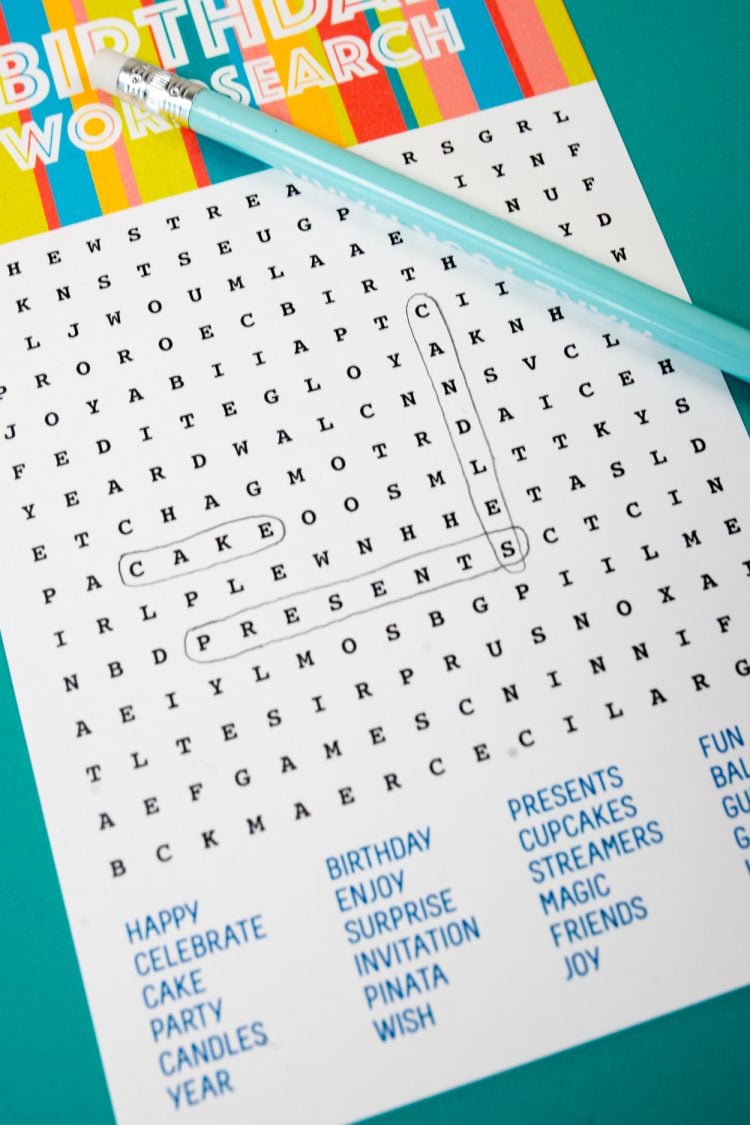Close up of a pencil and a Birthday Word Search 