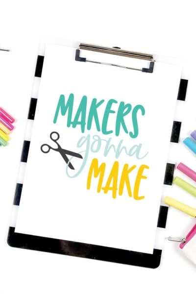 Colorful markers next to a clip board with a piece of paper on it that says, "Makers Gonna Maker"