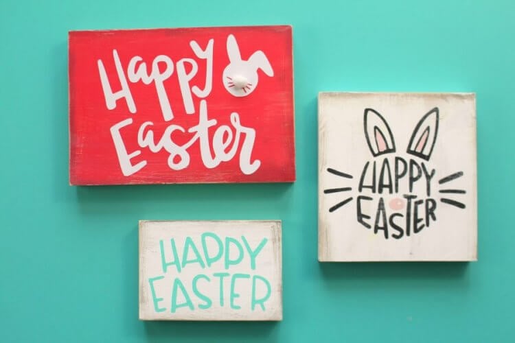 Three signs all saying \"Happy Easter\"