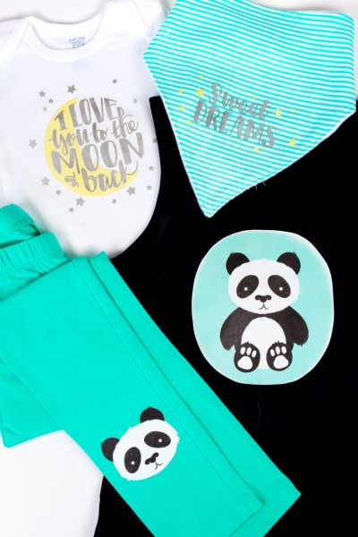 Baby clothes decorated with panda bears and the sayings, "Sweet Dreams" and "I Love You to the Moon and Back"