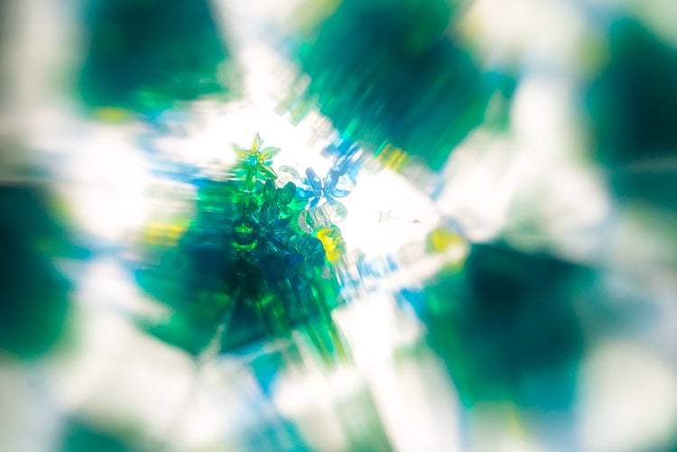 Image of the inside of a kaleidoscope of translucent beads 