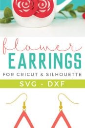 Some greenery next to a coffee cup that has two suede flower earrings hanging from it with advertising for flower earrings for Cricut and Silhouette from HEYLETSMAKESTUFF.COM