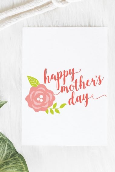 An image of a rose and the text "Happy Mother's Day" on a piece of white paper