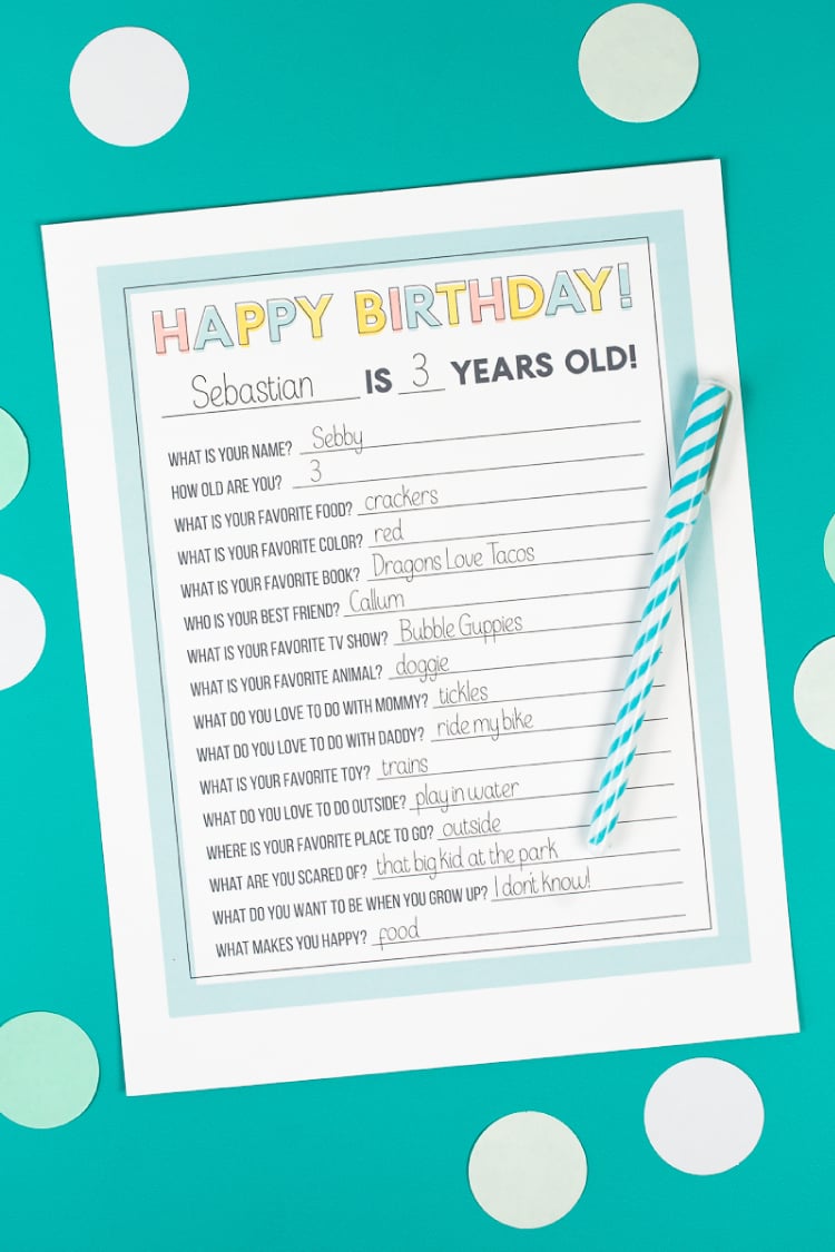 A pen and a piece of paper with a printed birthday questionnaire on it