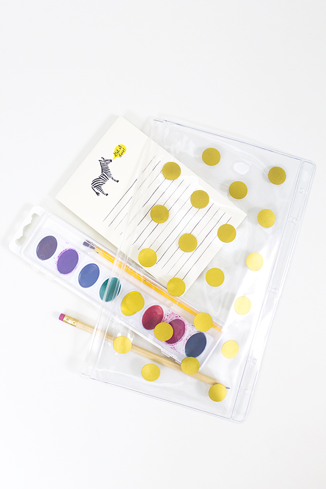 A vinyl pencil pouch decorated with gold dots