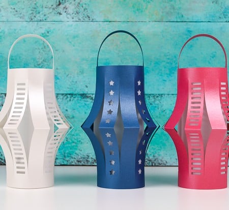 Get the free SVG cut files for these patriotic DIY paper lanterns! Delicate cut-outs made using your Cricut make these star-spangled lanterns a hit at any Fourth of July party.