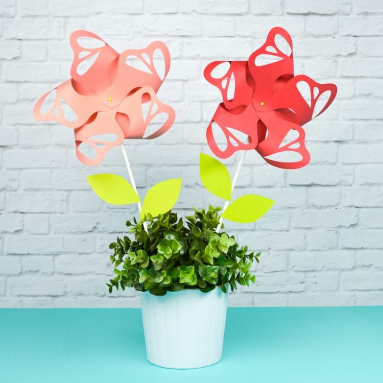 Paper pinwheels stuck inside of a potted plant