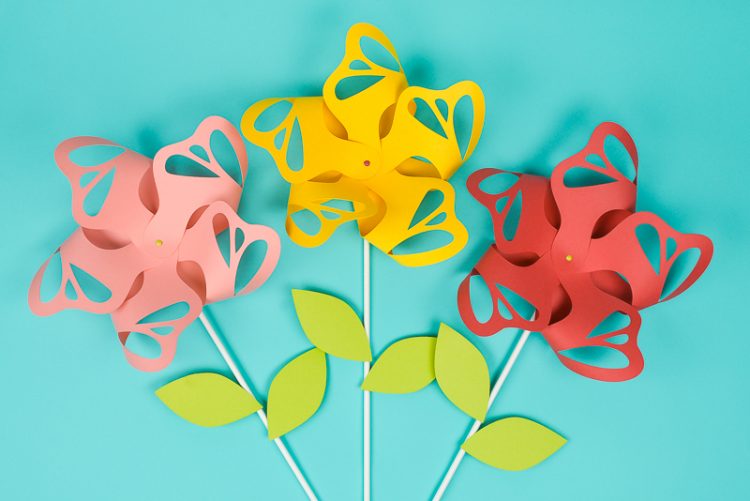 Three pinwheels cut out of paper