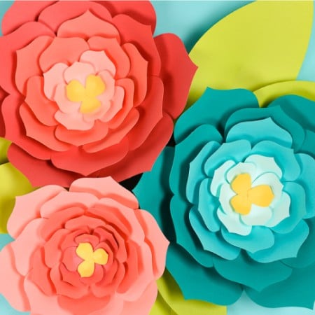 Download this giant paper flower template (hand cut or SVG for the Cricut) and then get my best tips and tricks for making them easily! Perfect for giant paper flower backdrops, beautiful home decor, and festive party decorations.