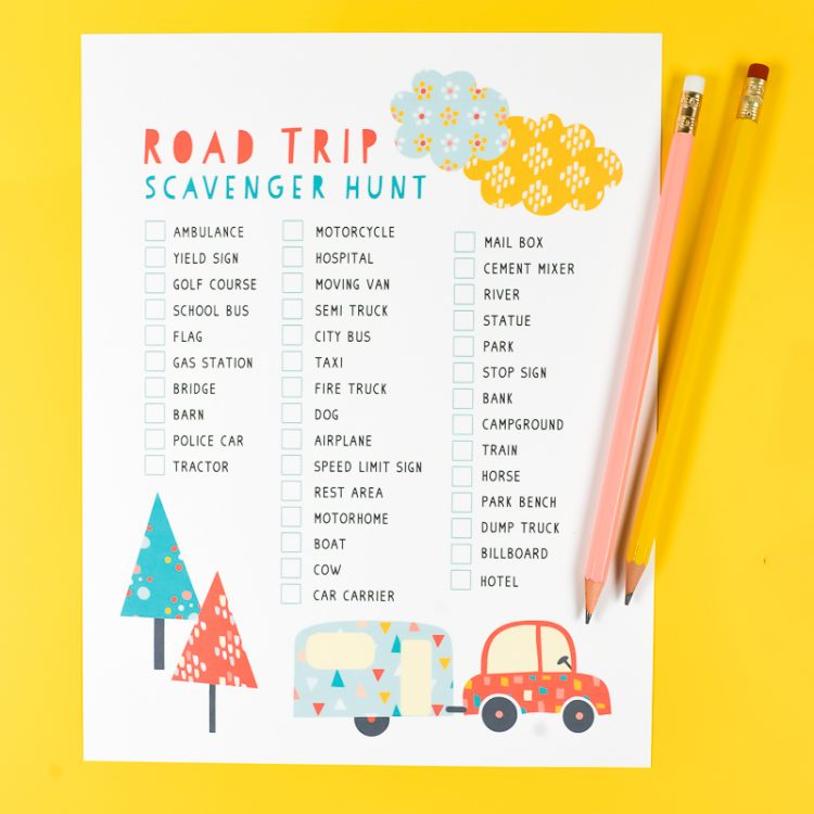 Two pencils on top of a sheet of paper that lists items for a road trip scavenger hunt