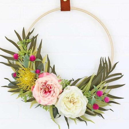 A spring wreath hanging on a wall