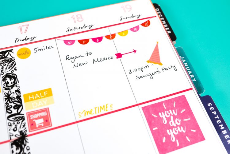 A close up of a weekly planner with stickers