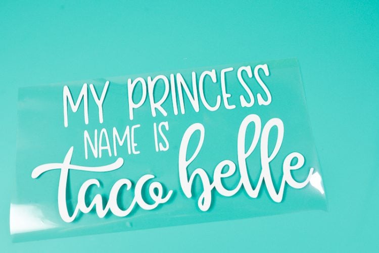 A weeded vinyl design that says, \"My Princess Name is Taco Belle\"
