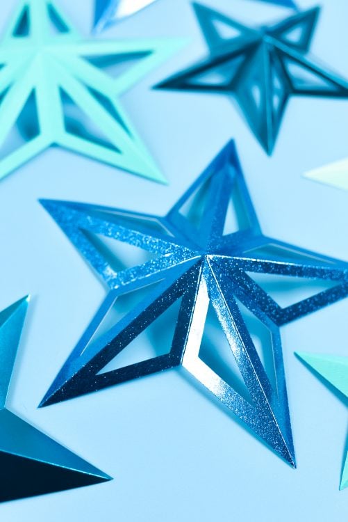 Close up of images of blue 3D paper stars