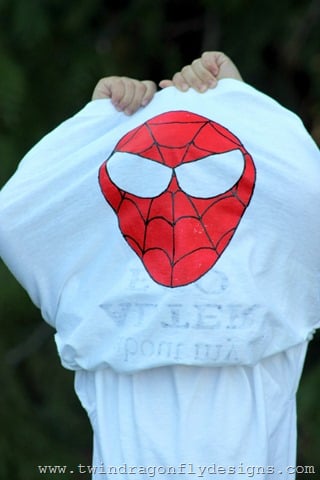 A person wearing a white t-shirt that flips into a Superhero Flip T-Shirt