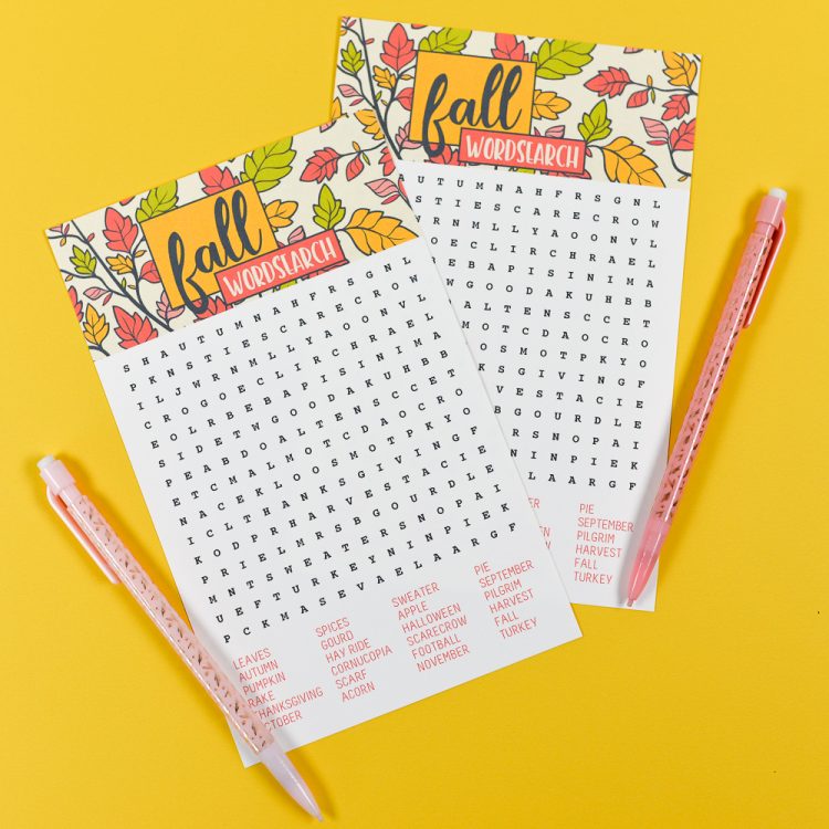 Two pencils on top of two fall wordsearch puzzles