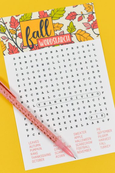 A pencil on top of a fall wordsearch puzzle