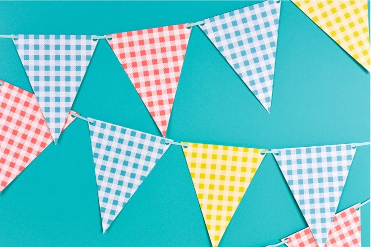 Close up image of buffalo plaid pennants in blue, yellow, red and white