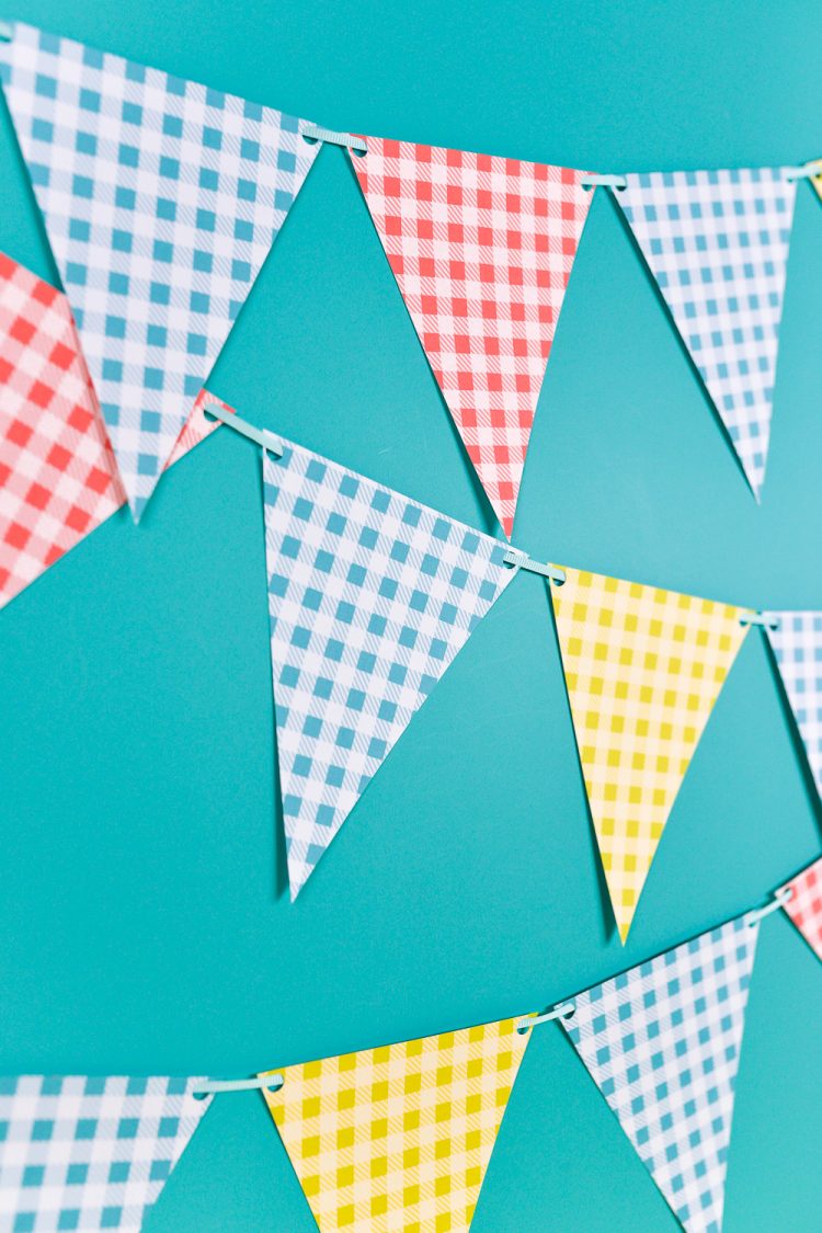 Close up image of buffalo plaid pennants in blue, yellow, red and white