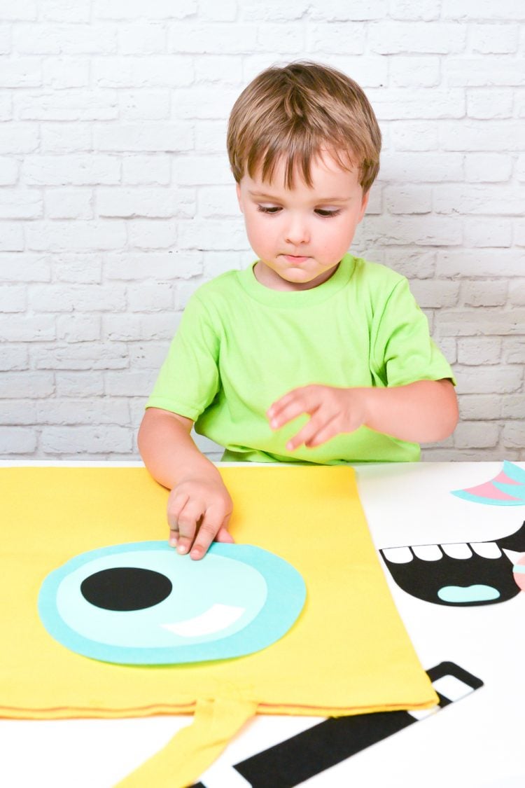 Kid Making a Monster Treat Bag