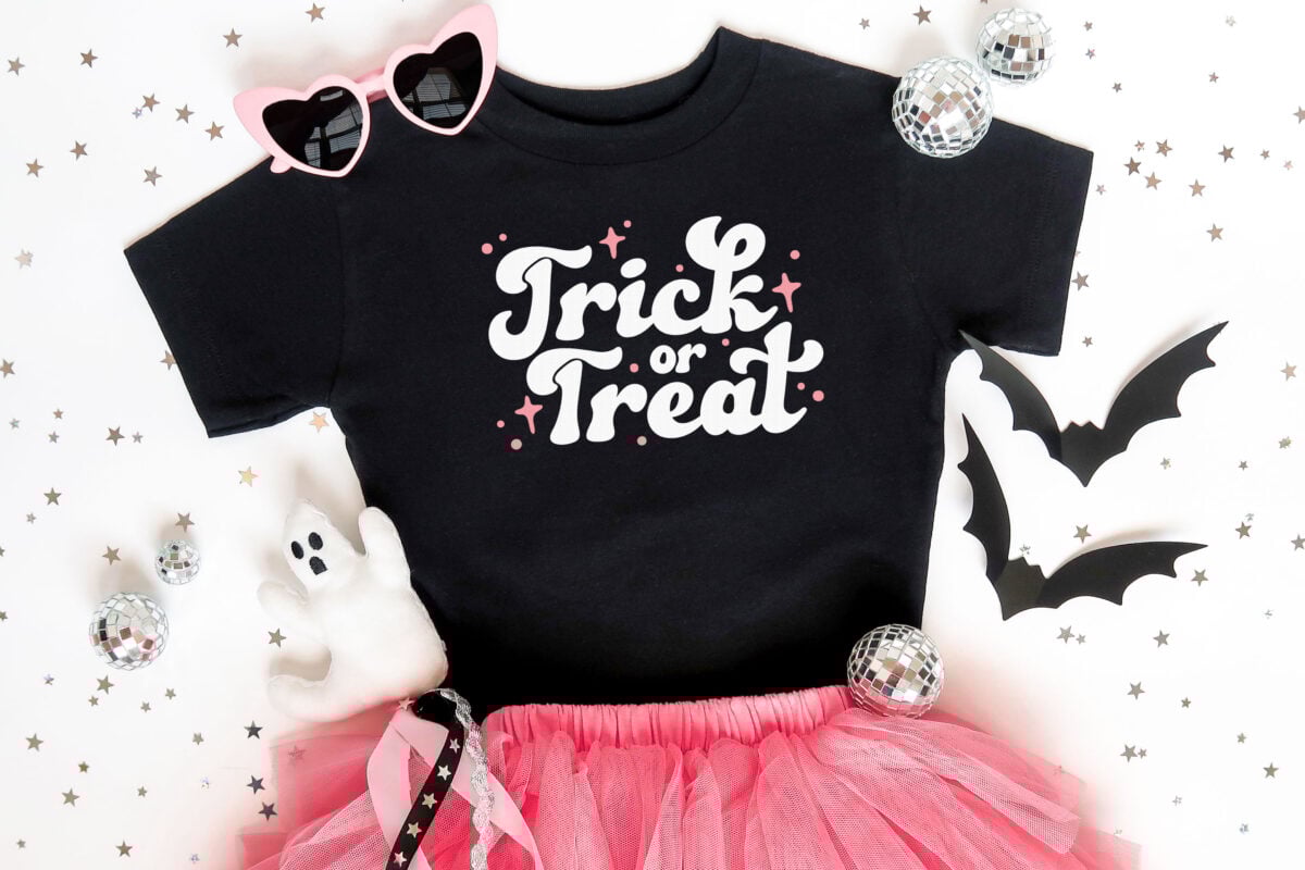 Trick or Treat SVG on a black tee with girlie halloween accessories