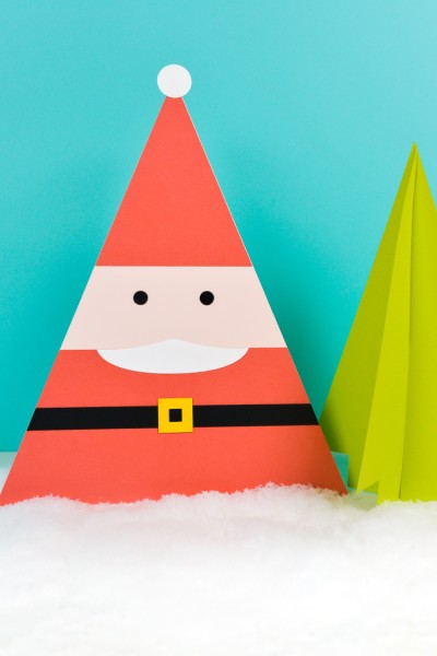 Image of a Santa and a tree cut from paper