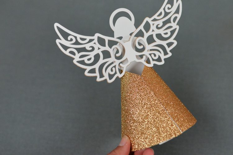 Hand holding a Paper Angel Christmas Tree Topper