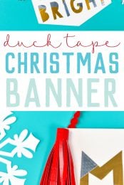 White paper cut snowflakes next to a red Tassel hanging over a sign that says, "Merry & Bright" with advertising from HEYLETSMAKESTUFF.COM on how to make a Christmas Banner with duck tape