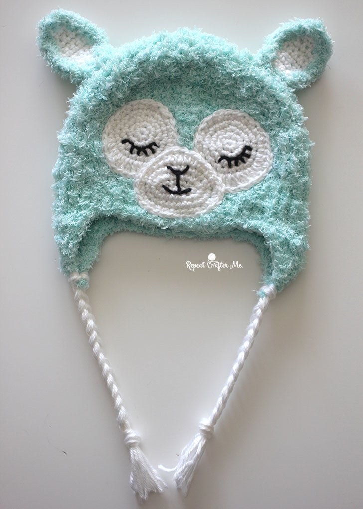 A crochet llama baby hat
