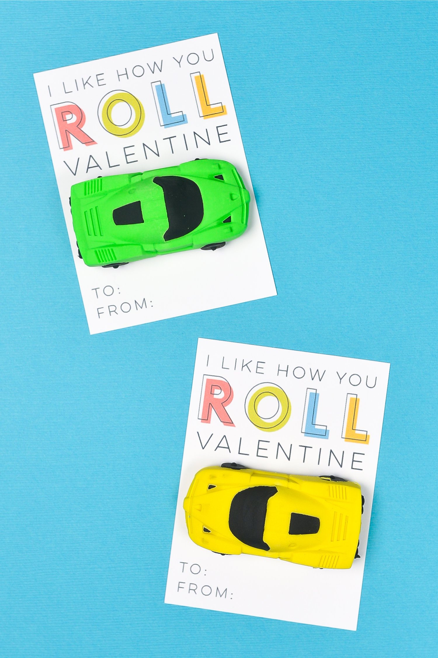 Two Valentine cards, one with a yellow toy car attached to it and the other one with a green toy car and both say, \"I Like How You Roll Valentine\"