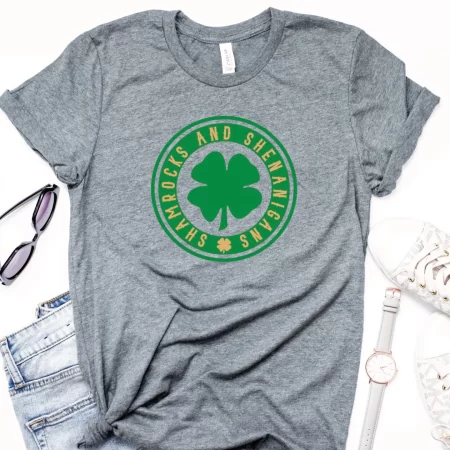Gray t-shirt with an image of a shamrock on it the the words Shamrocks and Shenanigans