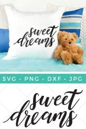 A teddy bear sitting next to several pillows where one pillow is white with the saying, "Sweet Dreams" on it and advertisement for cut file from HEYLETSMAKESTUFF.COM