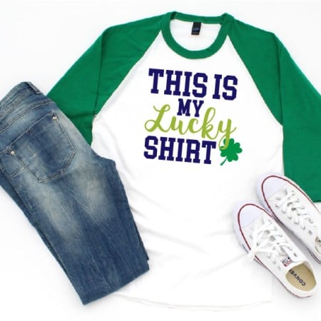 White and green baseball style shirt with a shamrock on it and the words This is My Lucky Shirt