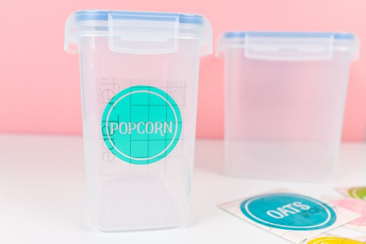 Container labeled with colorful label that says popcorn and another container that has no label on it