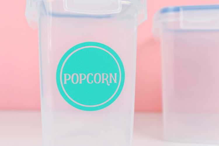 Container labeled with colorful label that says popcorn