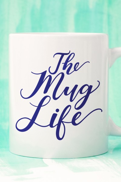 A white coffee mug with the saying, "The Mug Life" on it
