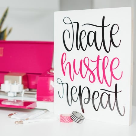 Create Hustle Repeat image on white sign with Cricut Explore AIr 2