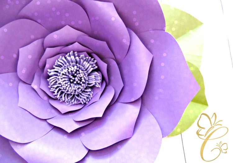 A close up of a purple paper cut flower