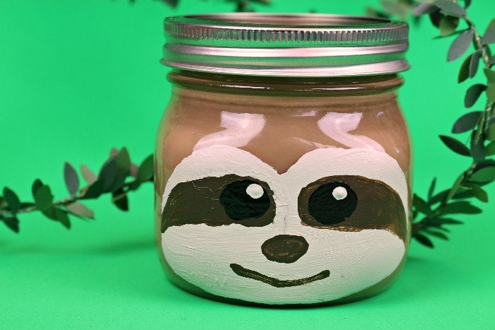 Sloth painted on a small Mason jar