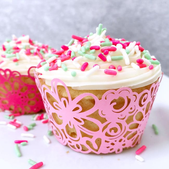 Decorated cupcakes inside of a floral lace cupcake wrapper