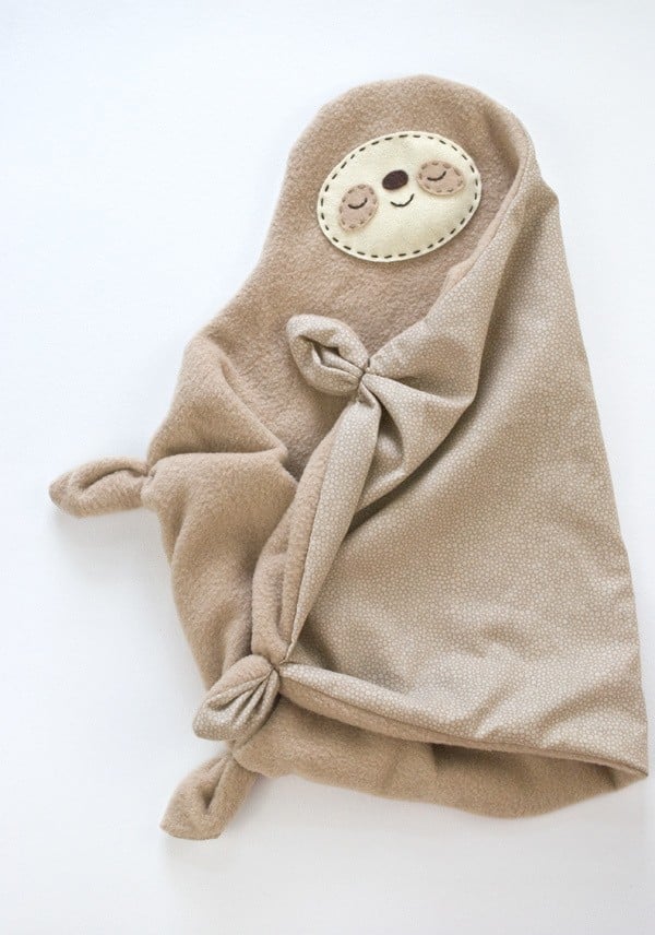 Sloth face sewn on a snuggly blanket