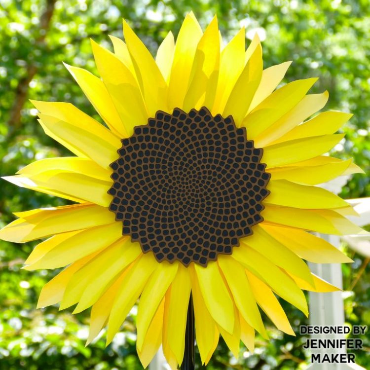 A close up of a giant paper sunflower