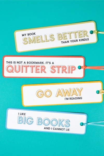 Four bookmarks that say, "My Book Smells Better Than You Kindle", "This is Not a Bookmark, it's a Quitter Strip", "Go Away I'm Reading" and "I Like Big Books and I Cannot Lie"